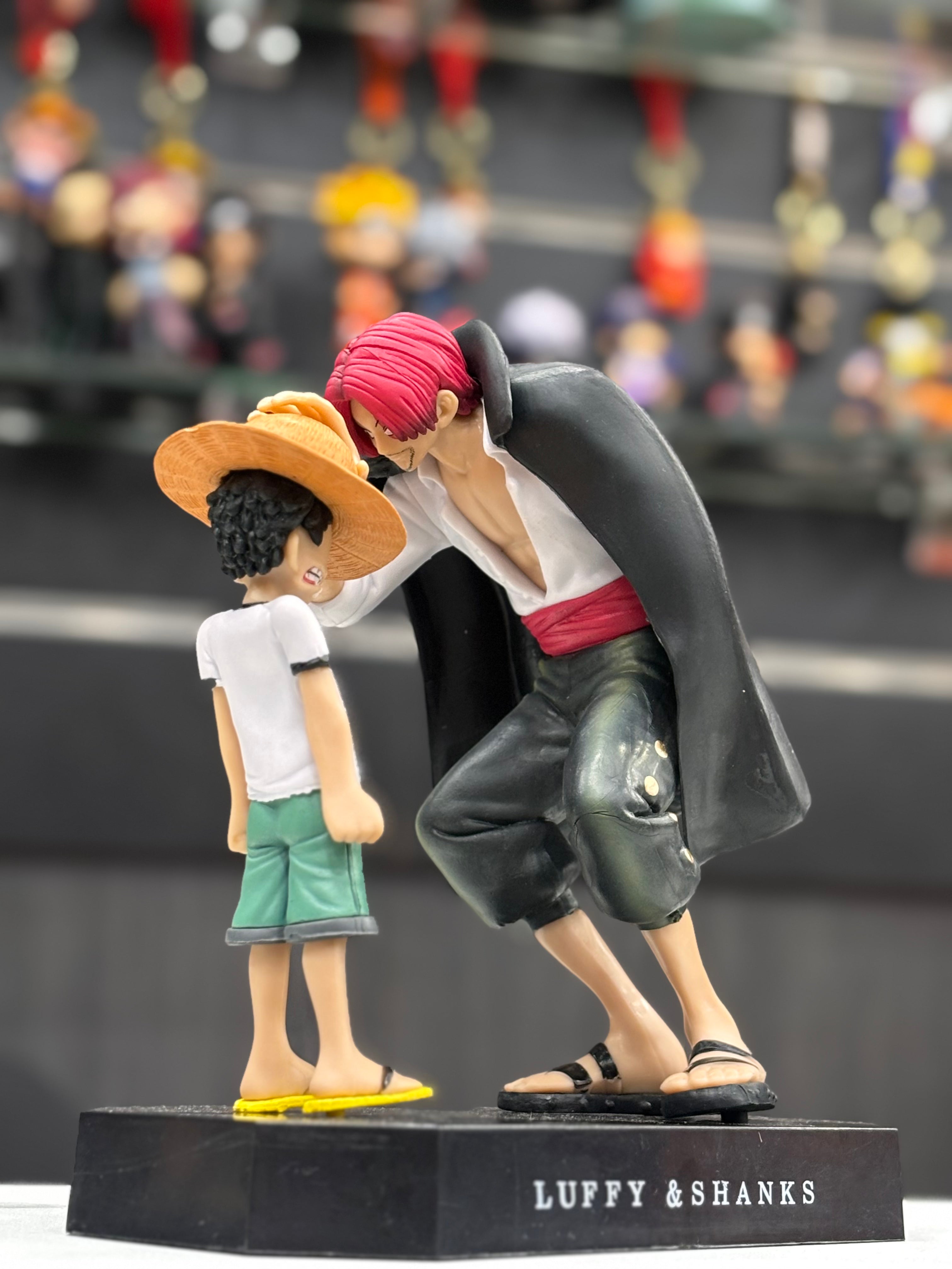 shanks giving luffy strawhat figure
